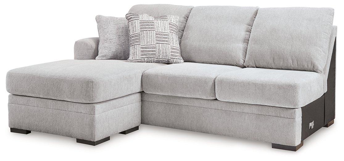 Ashley Furniture Gabyleigh sectional with chaise showing plush fabric upholstery and modern design in a well-lit living room setting.