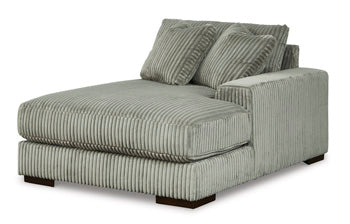 Ashley Furniture Lindyn sectional with chaise, showing a modern sofa with plush cushions and a spacious design from an angled view.