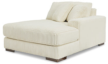 Ashley Furniture Lindyn sectional with chaise, angled view showing plush fabric and modern design for comfortable living space.