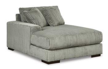Ashley Furniture Lindyn sectional with chaise, showcasing a modern fabric sectional sofa with plush cushions and a spacious chaise lounge.
