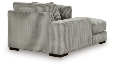 Ashley Furniture Lindyn sectional with chaise, featuring a modern fabric design and plush seating for comfortable lounging.