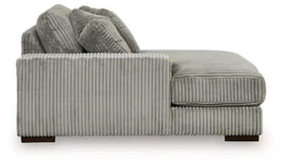 Ashley Furniture Lindyn sectional with chaise, featuring plush cushions and modern design, shown in a stylish living room setting.