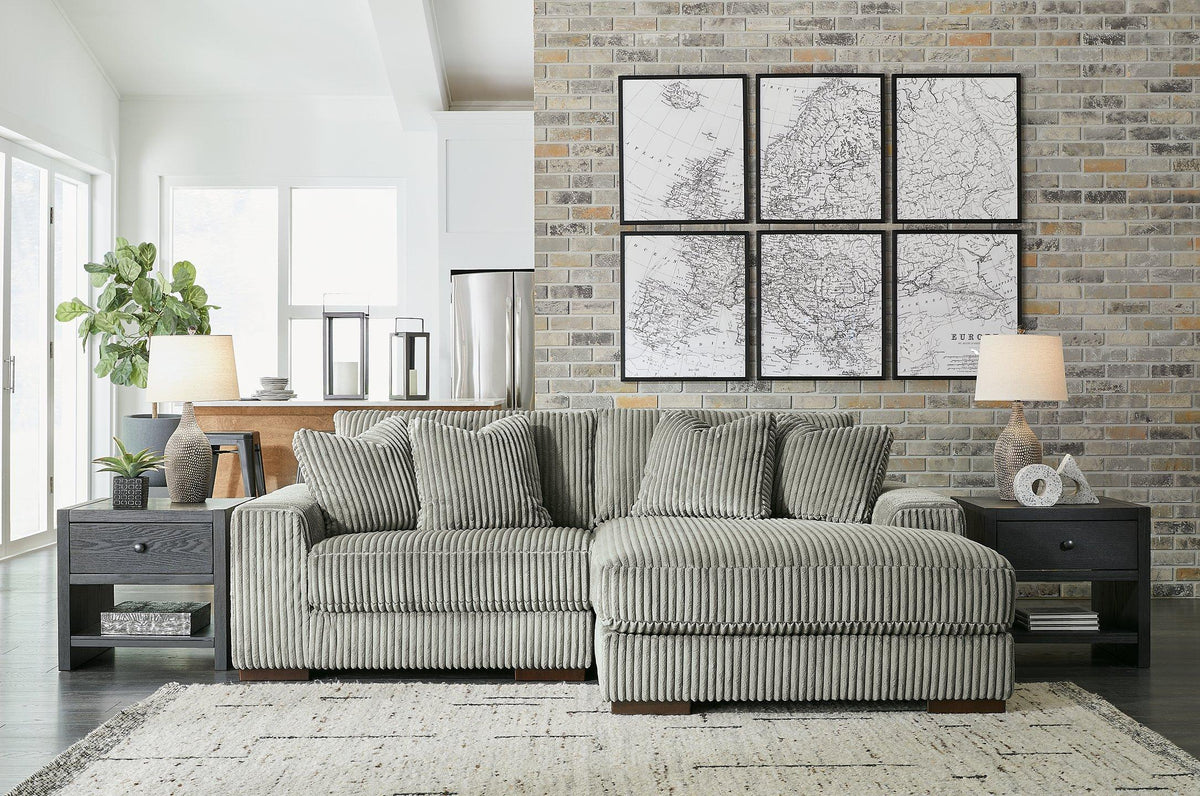 Ashley Furniture Lindyn sectional with chaise, showcasing plush fabric upholstery and modern design in a spacious living room setting.