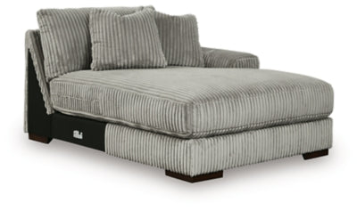 Ashley Furniture Lindyn sectional with chaise, showing a modern fabric sofa with plush cushions and a spacious chaise lounge.
