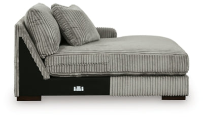 Ashley Furniture Lindyn sectional with chaise, showing a modern fabric sofa with plush cushions and a spacious chaise lounge.