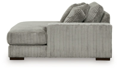 Ashley Furniture Lindyn sectional with chaise, featuring plush fabric upholstery and modern design, shown from the side.