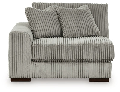 Ashley Furniture Lindyn sectional with chaise, showing plush fabric upholstery and modern design from a front head-on view.