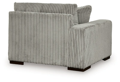 Ashley Furniture Lindyn sectional with chaise, showing plush fabric upholstery and modern design in a stylish living room setting.