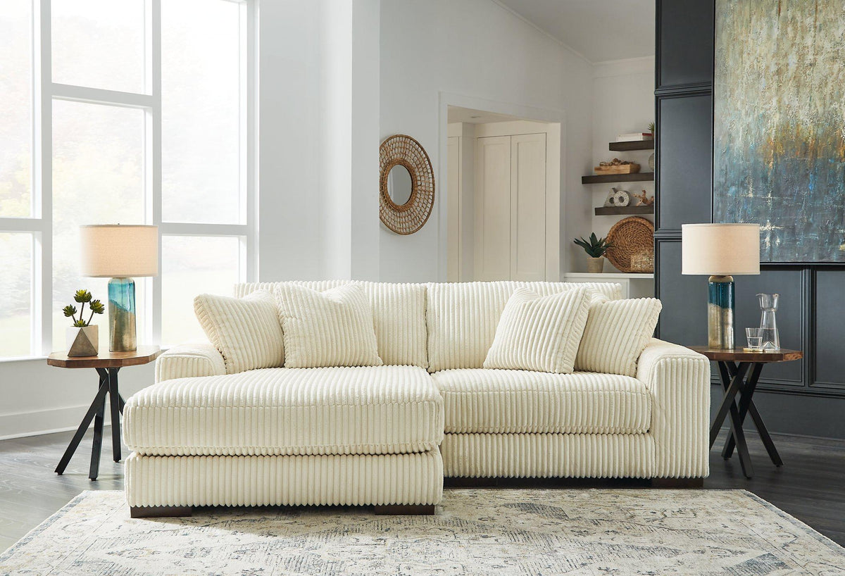 Ashley Furniture Lindyn sectional with chaise, featuring plush fabric, modern design, and spacious seating arrangement.