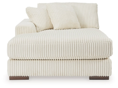 Ashley Furniture Lindyn sectional with chaise, showing plush fabric upholstery and modern design in a cozy living room setting.