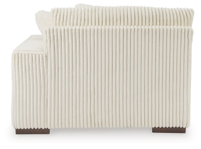 Ashley Furniture Lindyn sectional with chaise, showing a stylish fabric sofa with plush cushions and a spacious chaise lounge.