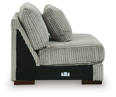 Ashley Furniture Lindyn sectional with chaise, featuring plush upholstery and modern design, shown from a side view.