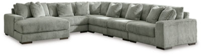 Ashley Furniture Lindyn sectional with chaise, featuring plush fabric upholstery, modern design, and spacious seating.