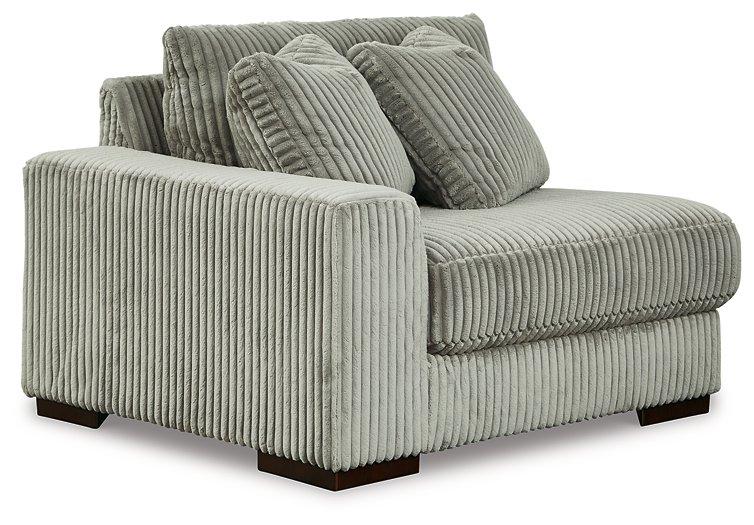 Ashley Furniture Lindyn sectional sofa with plush cushions and modern design, shown in a living room setting.