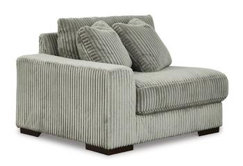 Ashley Furniture Lindyn sectional sofa with plush cushions, neutral fabric, and modern design perfect for living room seating.