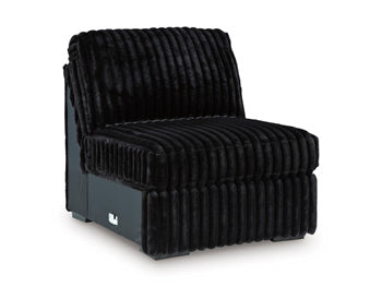 Ashley Furniture Midnight-Madness sectional sofa shown from an angled view, featuring plush cushions and modern design.