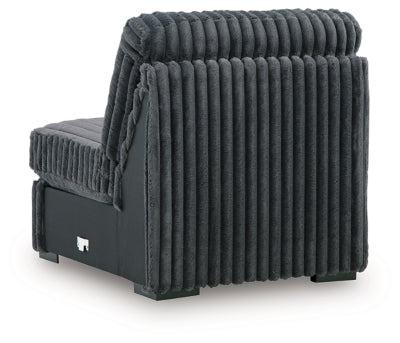 Ashley Furniture Midnight-Madness sectional sofa with plush cushions and dark upholstery, shown from the back view.