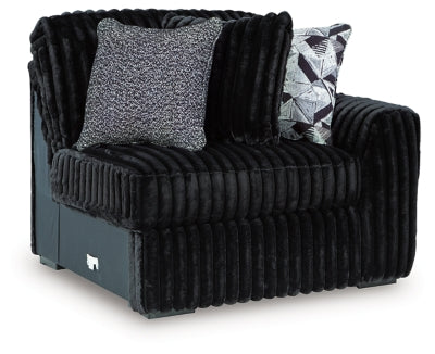 Ashley Furniture Midnight-Madness sectional sofa in a modern living room, showing the L-shaped design and plush upholstery.