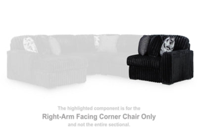Ashley Furniture Midnight-Madness sectional sofa with plush fabric, featuring multiple seating sections and a modern design.