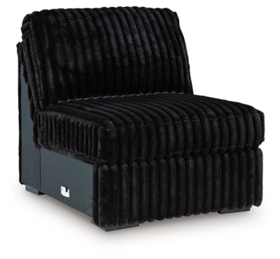 Ashley Furniture Midnight-Madness sectional sofa shown from an angled view, featuring plush cushions and modern design.