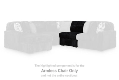 Ashley Furniture Midnight-Madness sectional sofa with plush fabric, multiple seating sections, and elegant design in a modern living room setting.