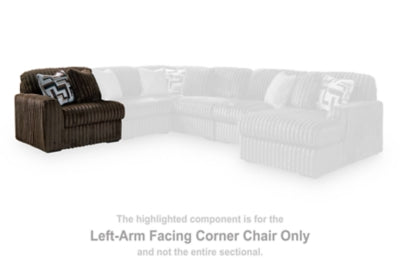 Ashley Furniture Midnight-Madness sectional sofa with plush cushions and dark upholstery, shown in a modern living room setting.