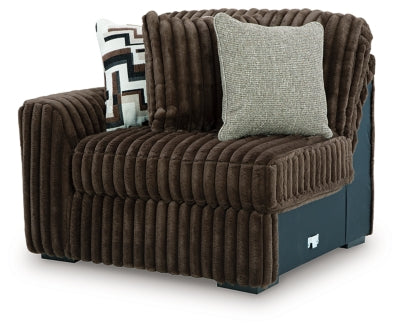 Ashley Furniture Midnight-Madness sectional sofa shown from an angled view, featuring plush cushions and modern design.