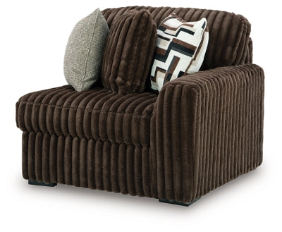 Ashley Furniture Midnight-Madness sectional sofa in a modern L-shape with plush cushions, viewed from an angled perspective.