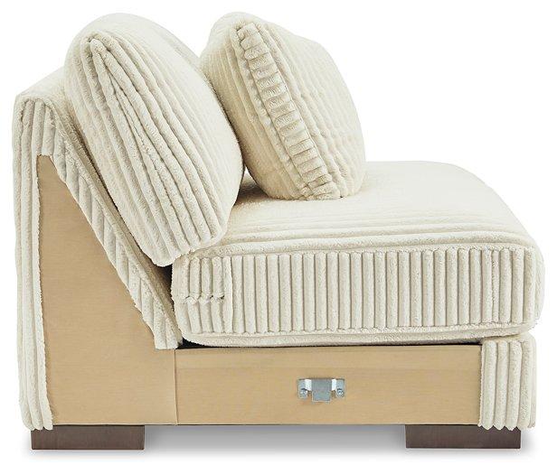 Ashley Furniture Lindyn sectional sofa with plush cushions and neutral fabric, designed for comfortable living room seating.