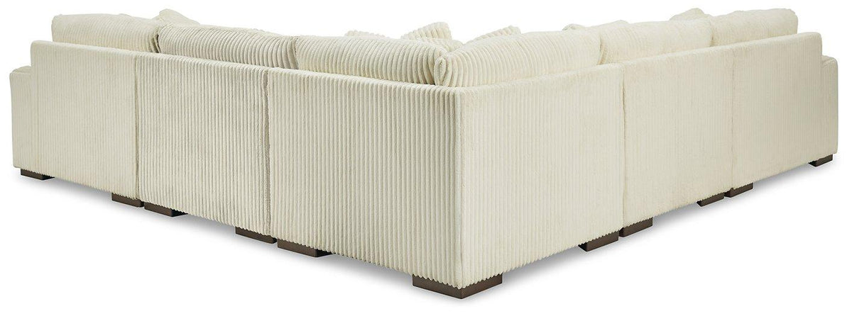 Ashley Furniture Lindyn sectional sofa with plush cushions and modern design, shown in a cozy living room setting.