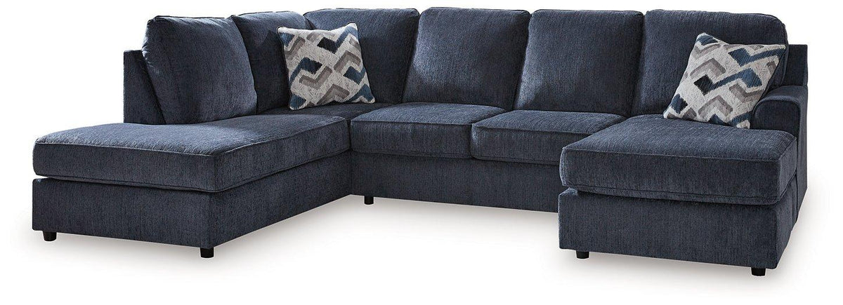 Ashley Furniture Albar Place sectional sofa with plush cushions and modern design, shown in a spacious living room setting.