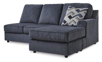 Ashley Furniture Albar Place Sectional sofa with plush cushions and modern design in a cozy living room setting.
