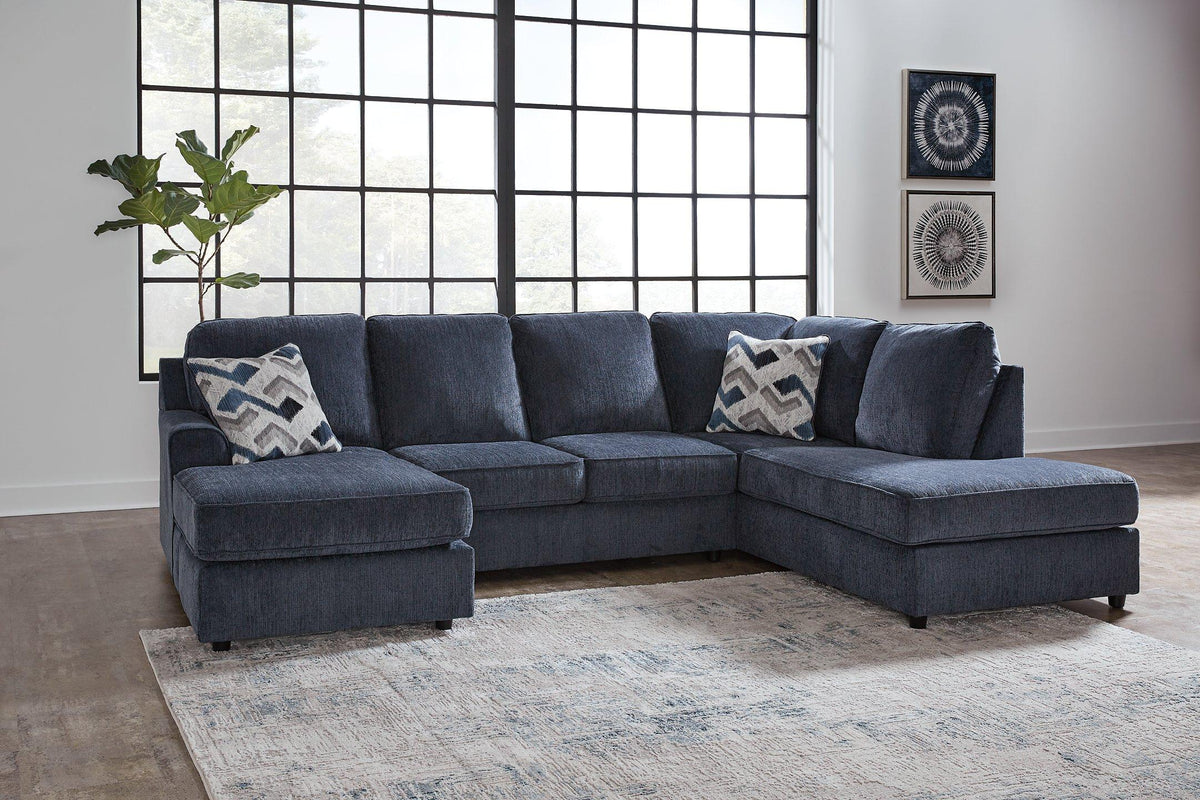 Ashley Furniture Albar Place sectional sofa with plush cushions and modern design, shown in a spacious living room setting.