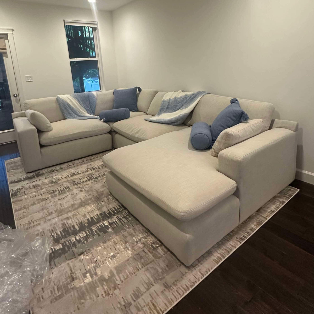 Ashley Furniture Atlas Cloud 4-piece sectional with left-facing chaise, featuring plush cushions and modern corner design.