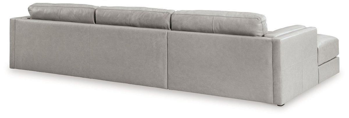 Ashley Furniture Amiata sectional with chaise, featuring plush upholstery and modern design, shown in a stylish living room setting.