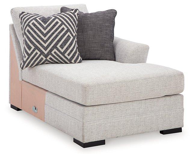 Ashley Furniture Koralynn sectional with chaise showing plush fabric upholstery and modern design in a cozy living room setting.
