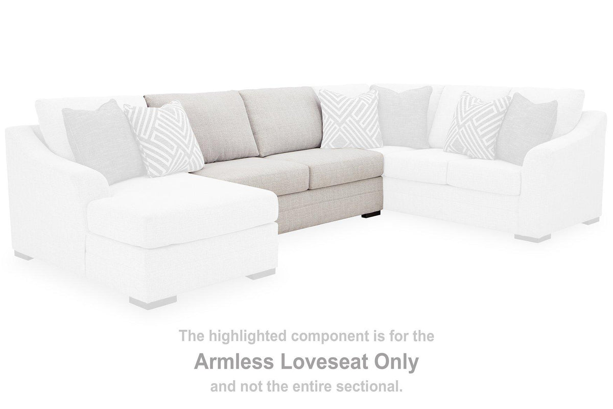 Ashley Furniture Koralynn sectional with chaise, showing the plush fabric, modern design, and spacious L-shaped couch with chaise lounge.