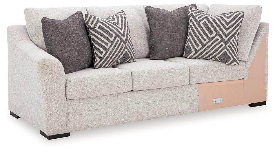 Ashley Furniture Koralynn sectional with chaise featuring plush cushions and modern design in a cozy living room setting.