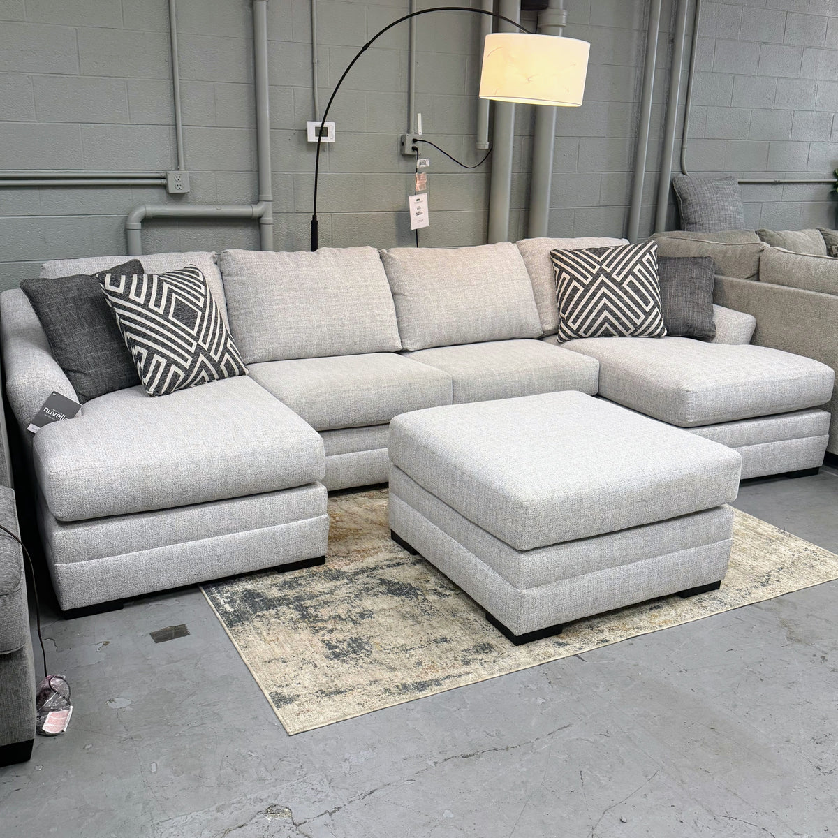 Ashley Furniture Koralynn sectional with chaise, showing plush fabric, multiple cushions, and modern design in a cozy living room setting.