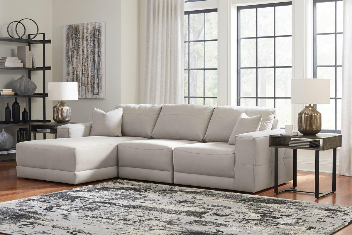 Ashley Furniture Next-Gen Gaucho sectional sofa with chaise, features plush cushions and modern design in a stylish living room setting.