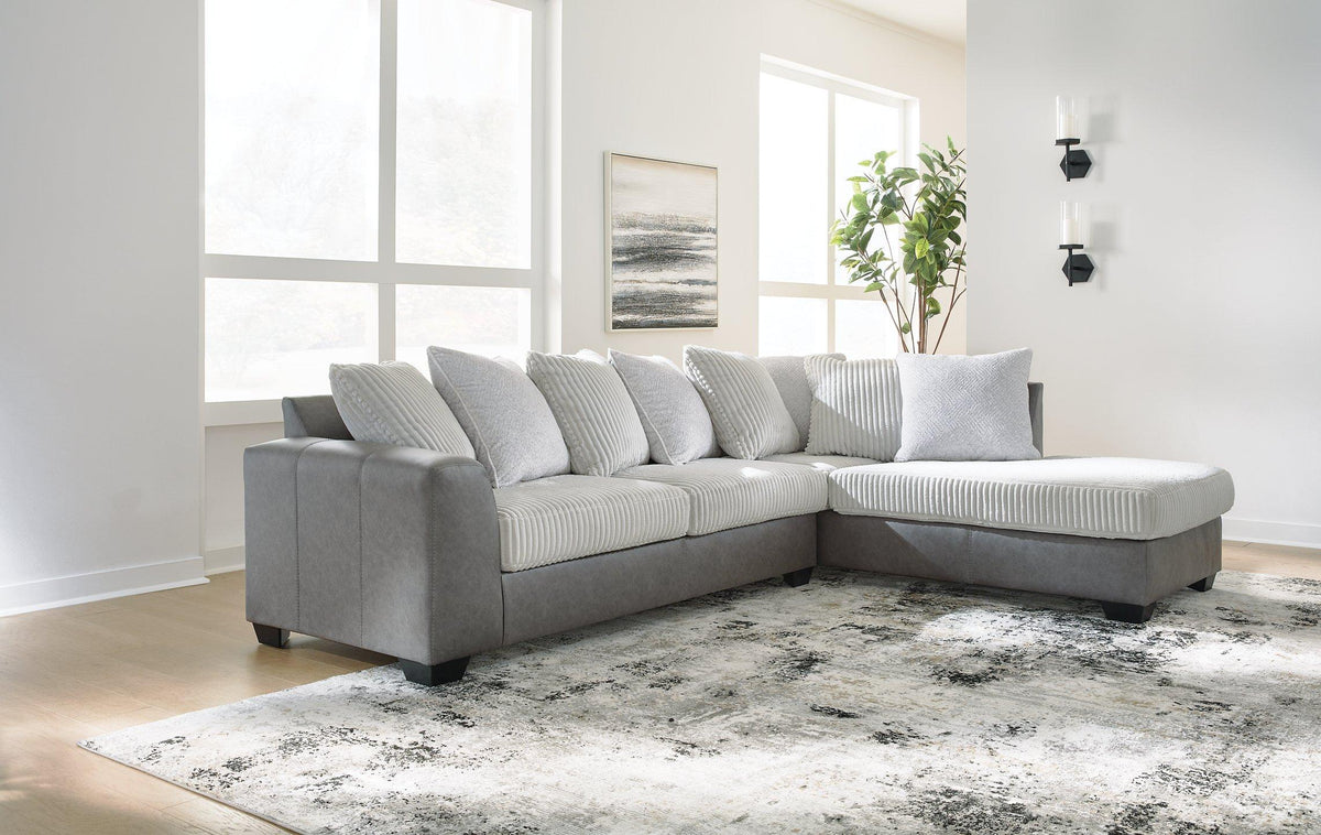 Ashley Furniture Clairette Court Sectional with chaise, beige fabric sofa with plush cushions and modern design.