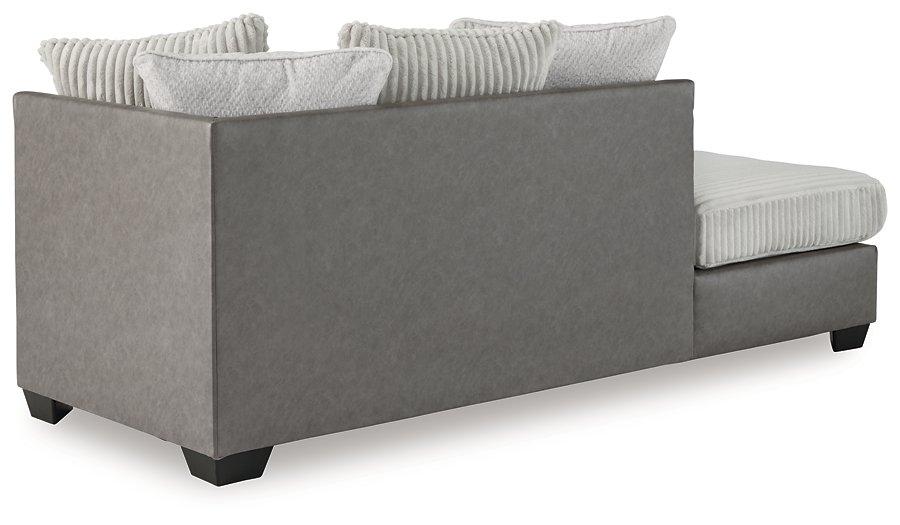 Ashley Furniture Clairette Court sectional with chaise, showing a modern fabric sofa with plush cushions and a spacious chaise lounge.