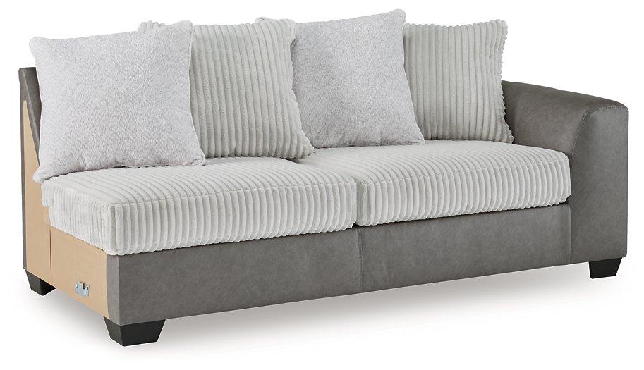 Ashley Furniture Clairette sectional with chaise, beige fabric upholstery, featuring plush cushions and modern design.