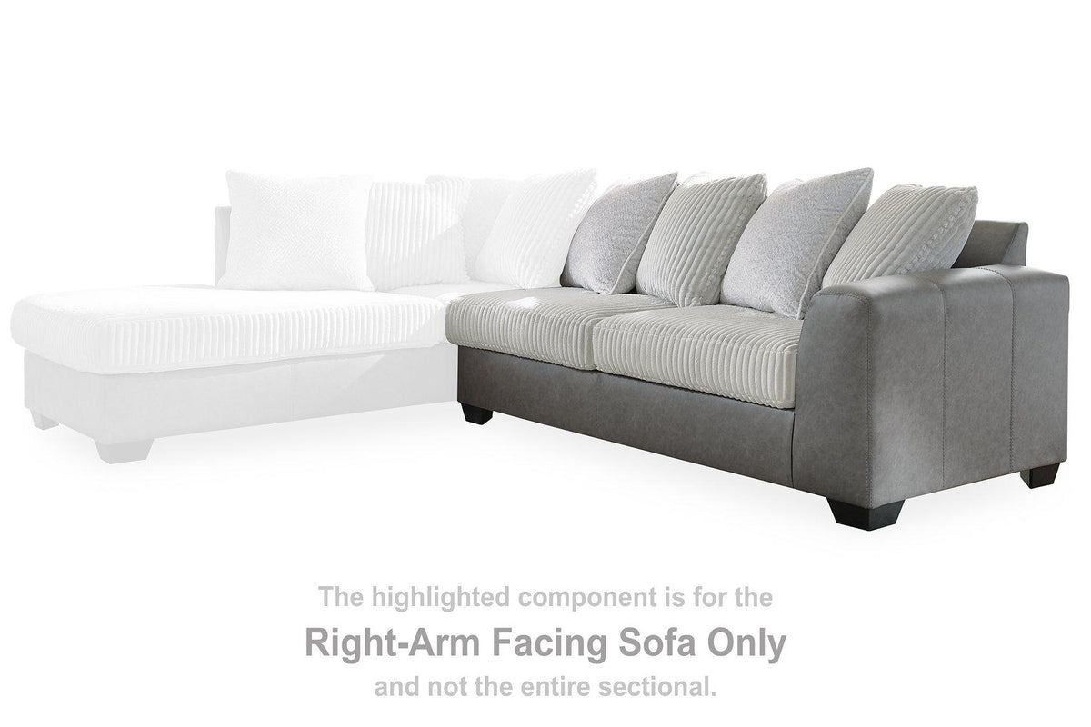 Ashley Furniture Clairette sectional with chaise, shown in a modern living room setting, featuring neutral upholstery and plush cushions.