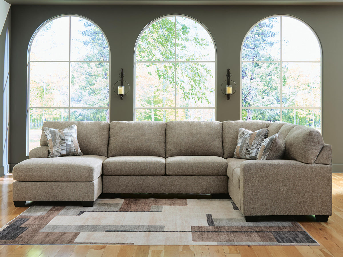 Ashley Furniture Newellen Sleeper Sectional with Chaise, tan fabric, with plush cushions and chaise lounge for comfortable seating.
