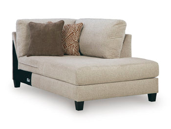 Ashley Furniture Steelwater Retreat sectional with chaise, showing plush fabric upholstery and modern design from an angled view.