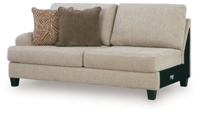 Ashley Furniture Steelwater Retreat sectional with chaise, showing plush gray fabric and modern design from an angled view.