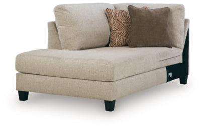 Ashley Furniture Steelwater Retreat sectional with chaise, featuring plush cushions and modern design, shown from an angled view.