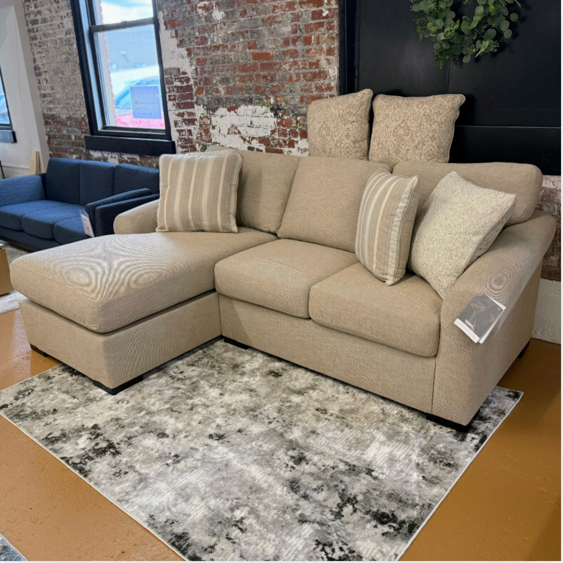 Ashley Furniture Lennox sofa sectional with chaise, featuring plush upholstery and modern design for comfortable living space.