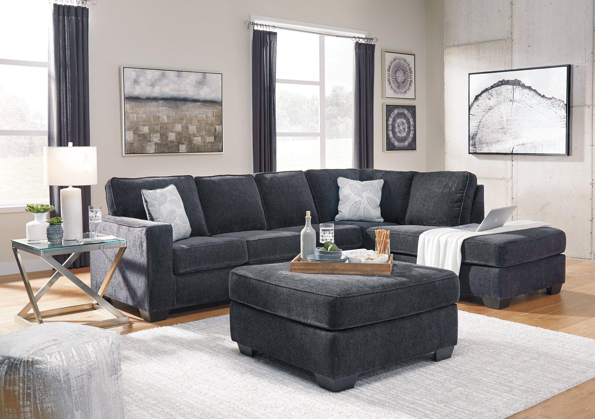 Ashley Furniture Altari sectional with chaise, showing plush fabric, modern design, and spacious seating arrangement.